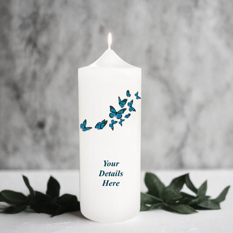 White candle with blue butterfly design and customisable text on a grey background