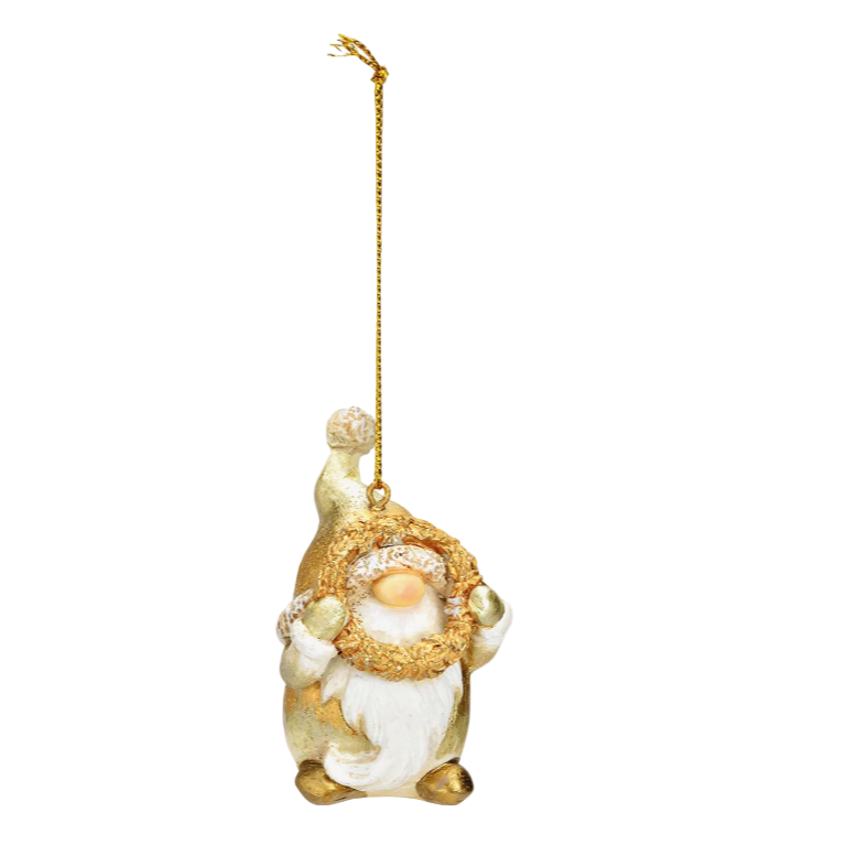 Decorative gnome ornament with gold and white details on a white background