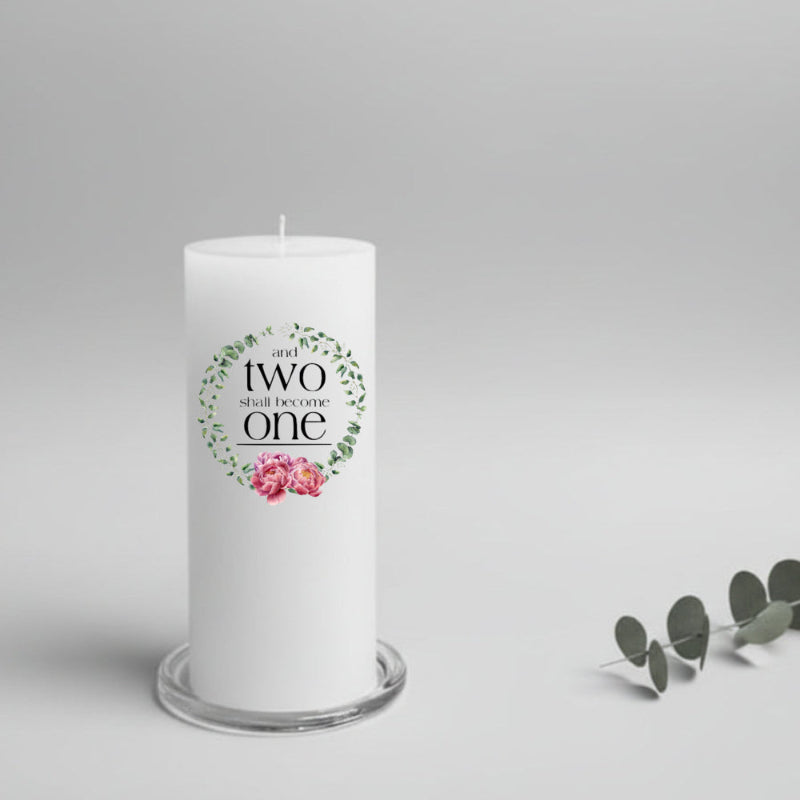 White wedding candle with decorative text and flowers on a gray background