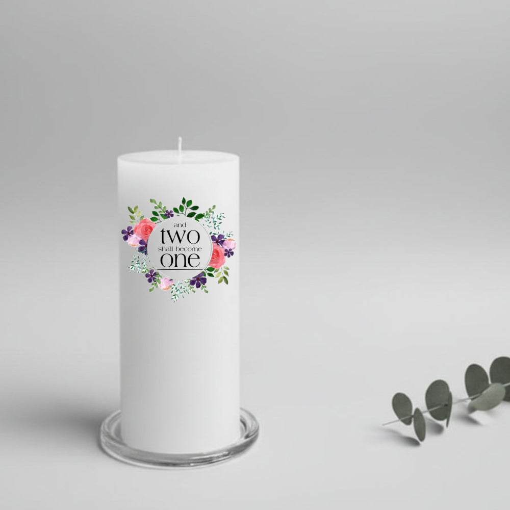 White wedding candle with floral design and text on a gray background