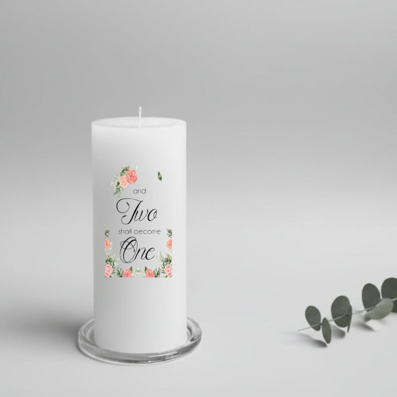 White wedding candle with floral design and text on a gray background