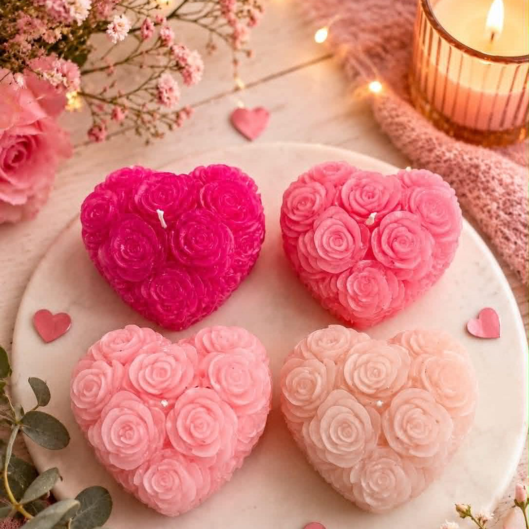 4 roes pink heart shaped candles with roses on a plate
