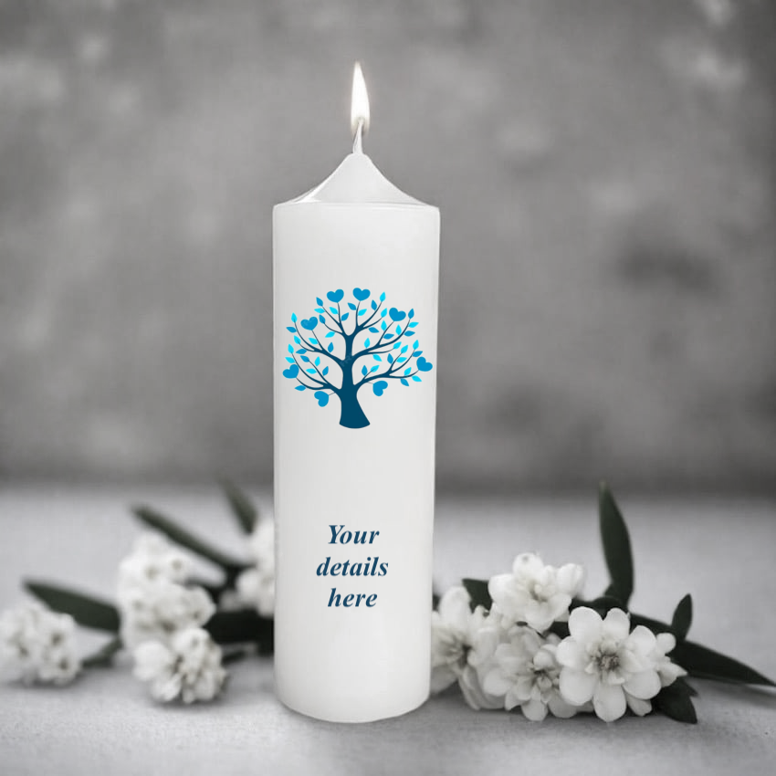 White candle with blue tree design and 'Your details here' text, surrounded by white flowers on a gray background