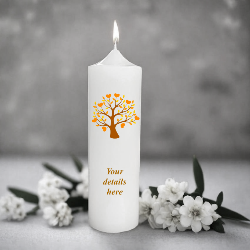 White candle with a orange tree design and text placeholder, surrounded by white flowers on a gray background