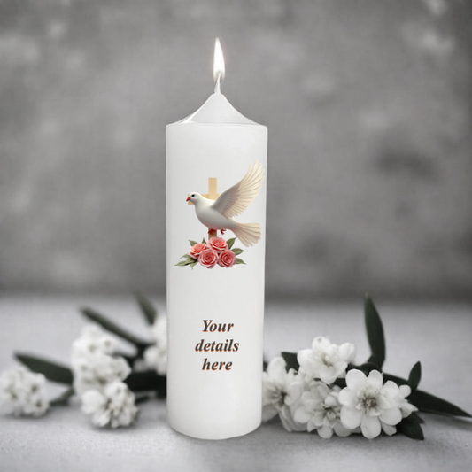 White candle with a dove and flowers design, surrounded by white flowers on a gray background