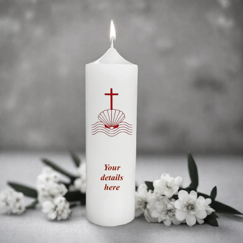 White candle with red cross and shell design,