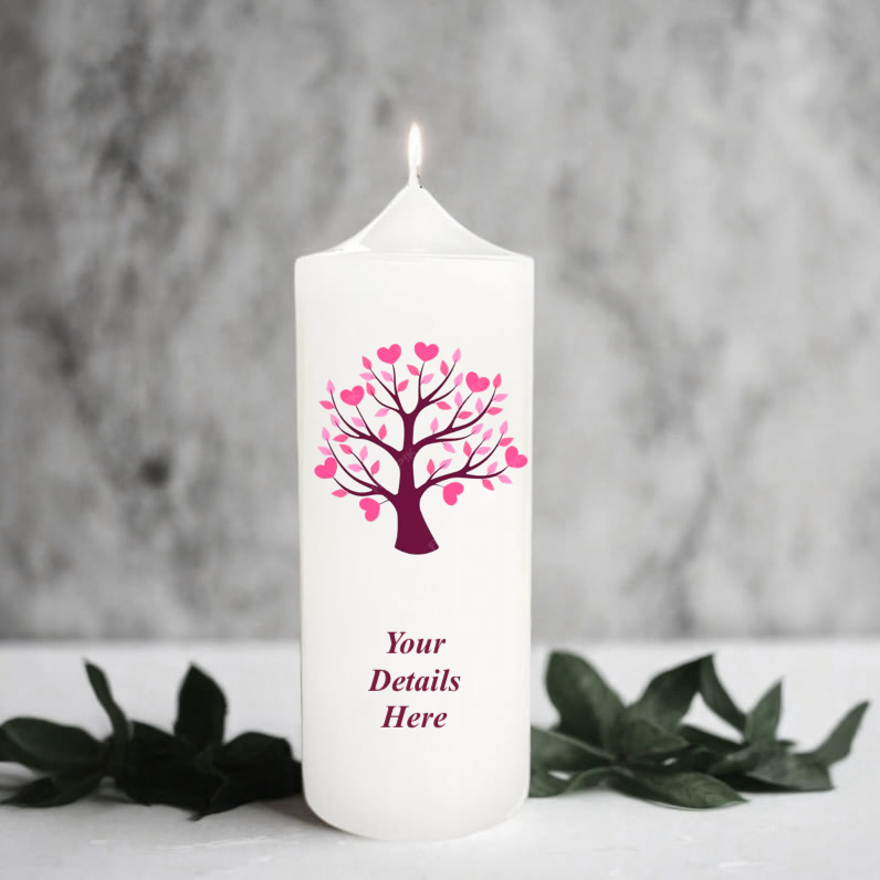 White candle with pink tree design and 'Your Details Here' text on a grey background