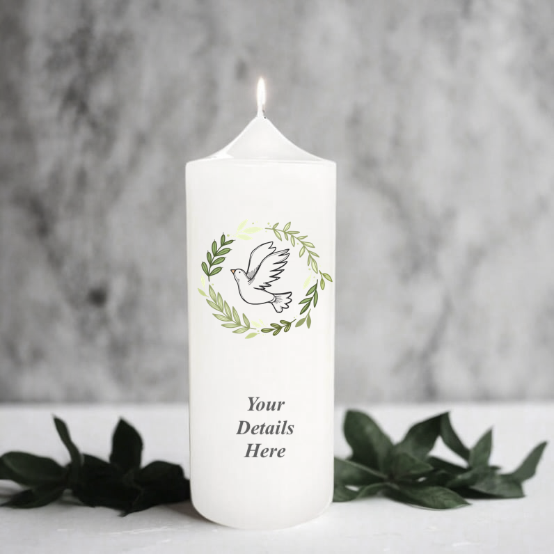 White candle with greenery design and text on a gray background