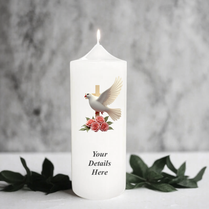 White candle with a dove and flowers design on a grey background