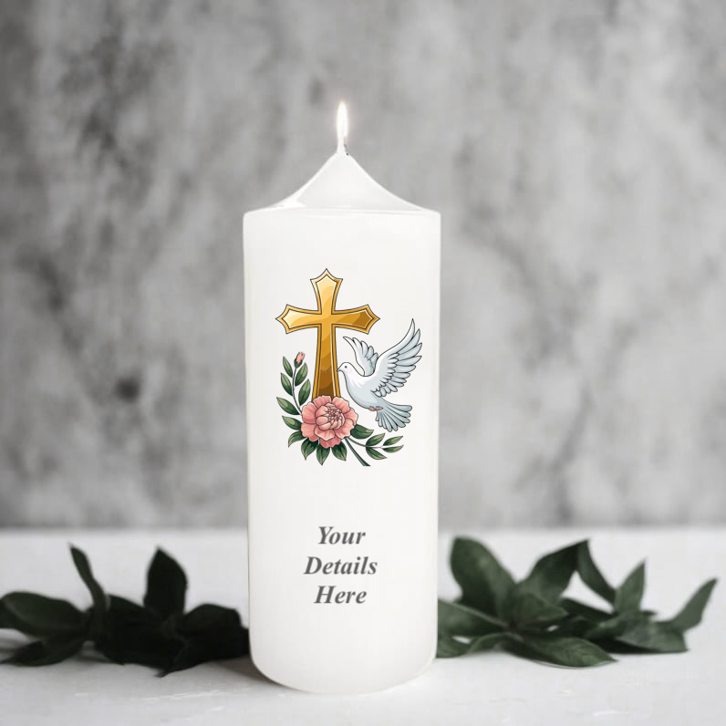 White candle with cross, dove, and flowers design on a gray background