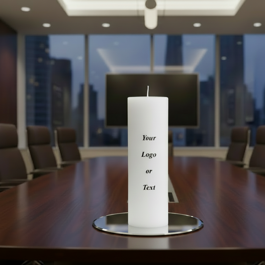 White candle with text or logo on a board room table