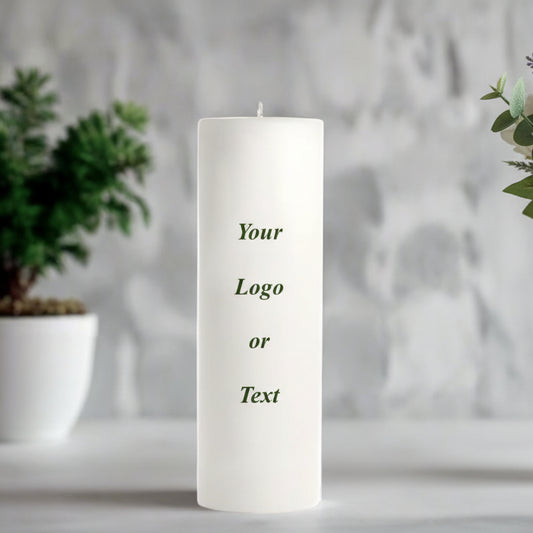 White candle with text on a blurred background