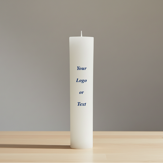 White candle on a wooden surface with a gray background