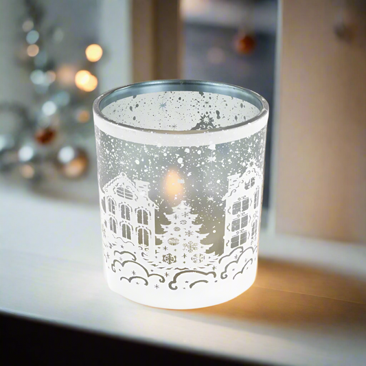 Decorative candle holder with winter village design 