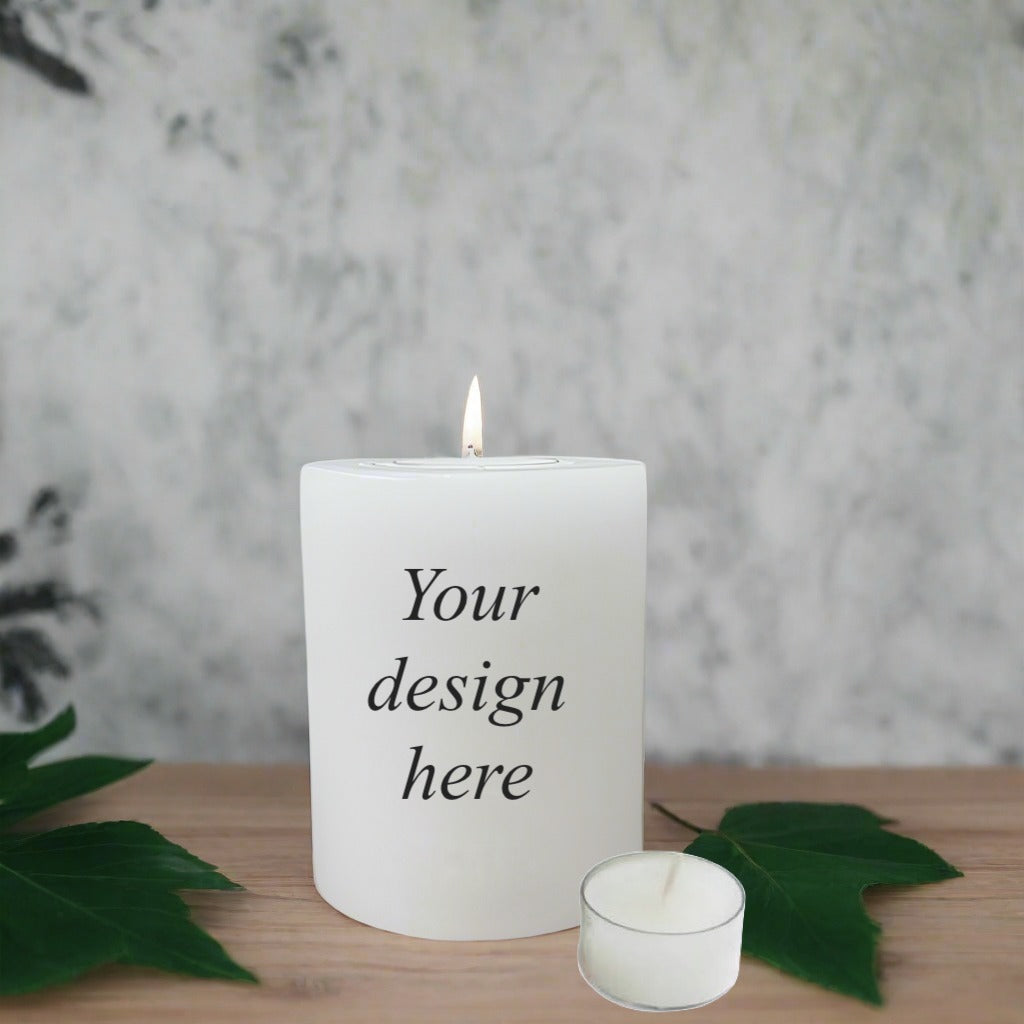 A white candle with a leaf and tea-light cup aside and a neutral background