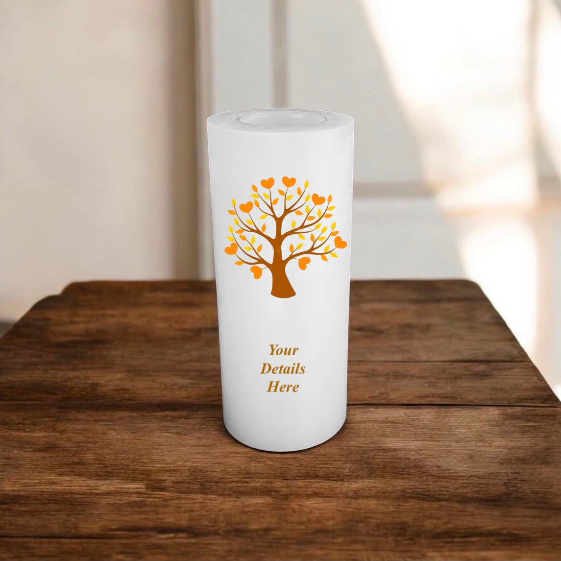 White candle with an orange tree design and 'Your Details Here' text on a wooden surface.
