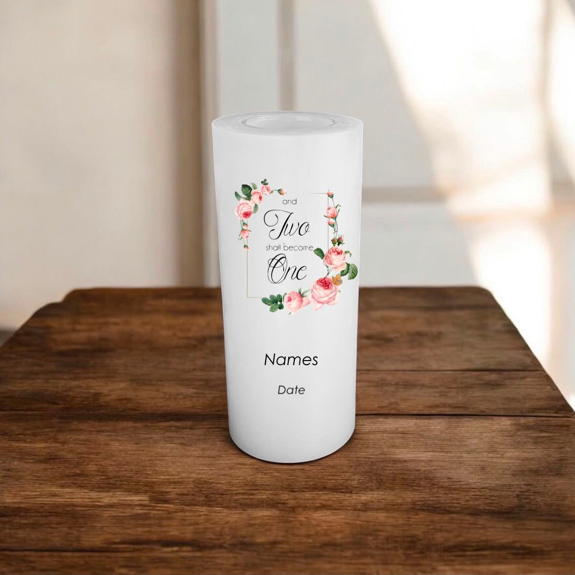 A white customisable candle with a floral design and the text.