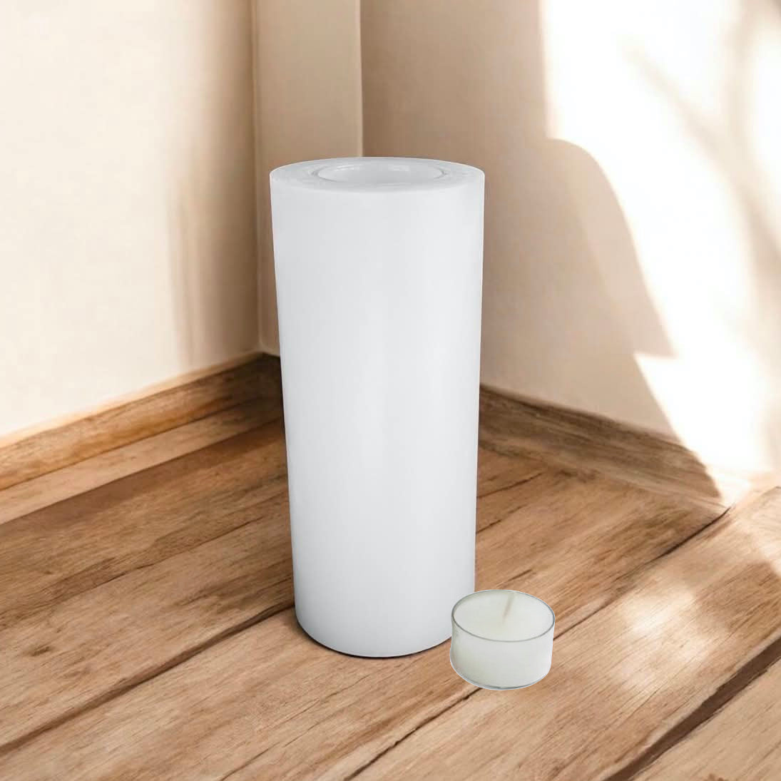 White candle with a built_in glass holder to place a tea-light, placed on a wooden surface.