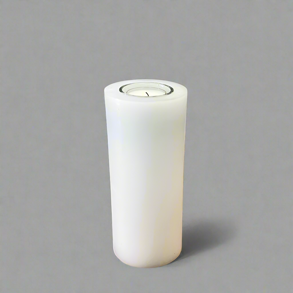A white pillar candle with a built-in glass holder to place a tealight or a flameless LED tealight.