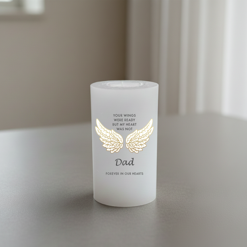 white candle with a text about Dad and wings, on a neutral background