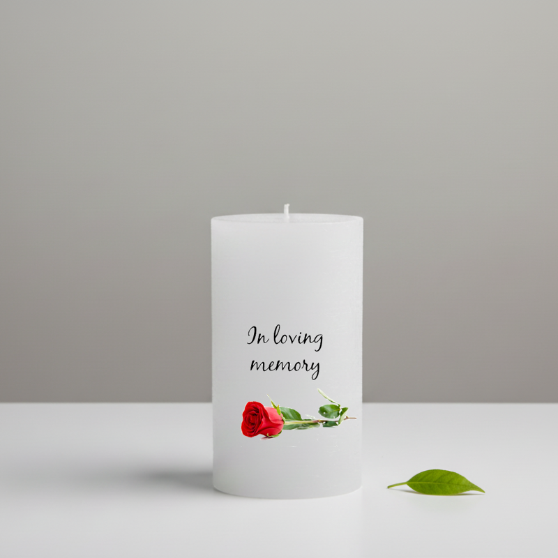 white candle printed with text and a rose 