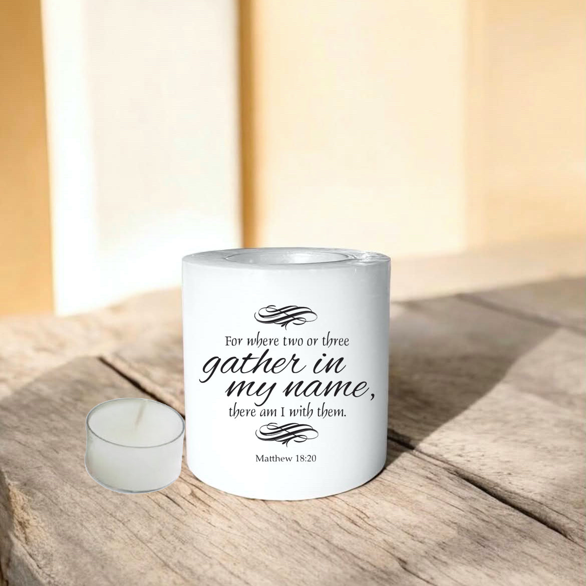 white everlasting candle with text on a wooden surface