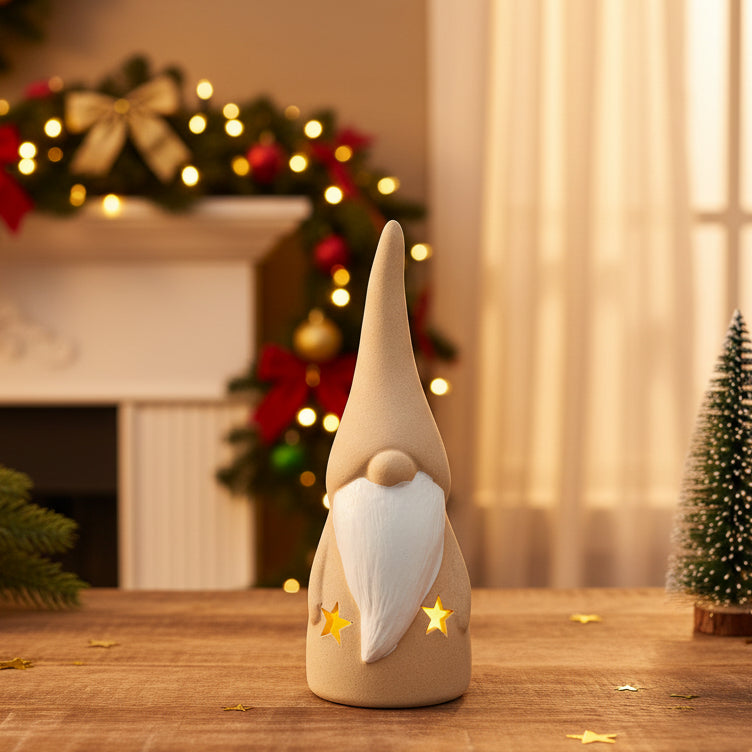 Decorative ceramic gnome figurine with a white beard and yellow stars on a white background