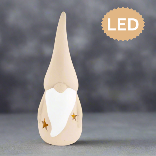 Decorative gnome figure with LED label on a gray background