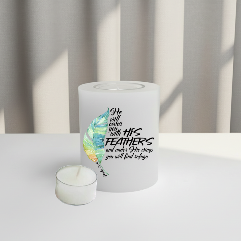 White everlasting candle with feather design and text on a white surface