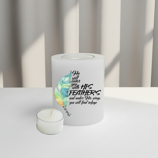 White everlasting candle with feather design and text on a white surface