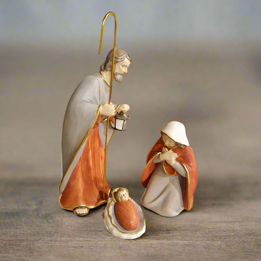 Nativity set 3 figurines on a wooden table