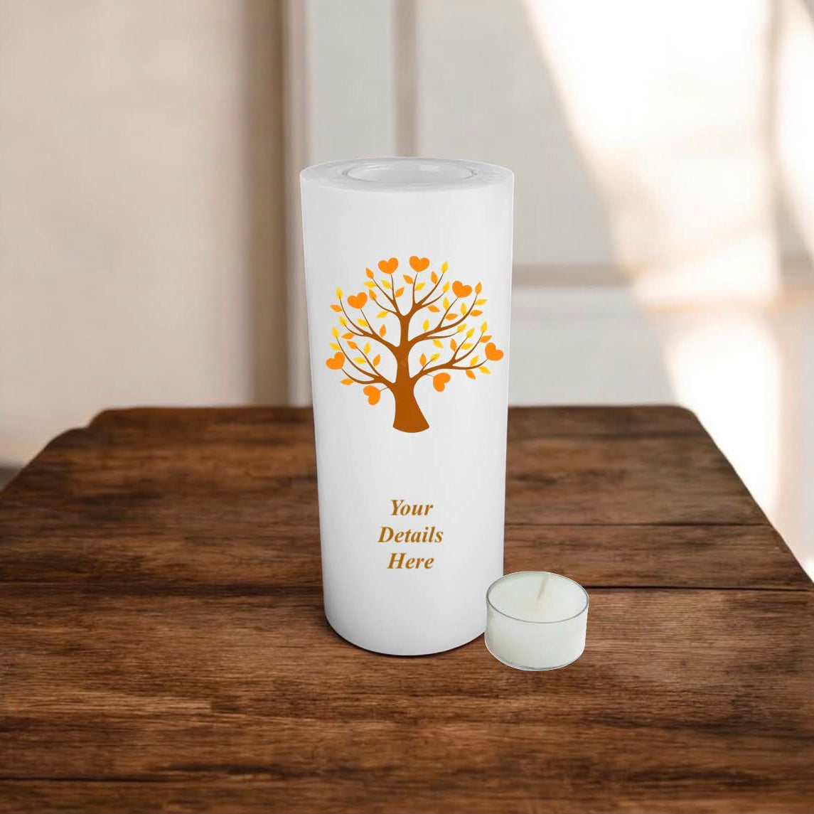 White candle with an orange tree design and 'Your Details Here' text on a wooden surface.