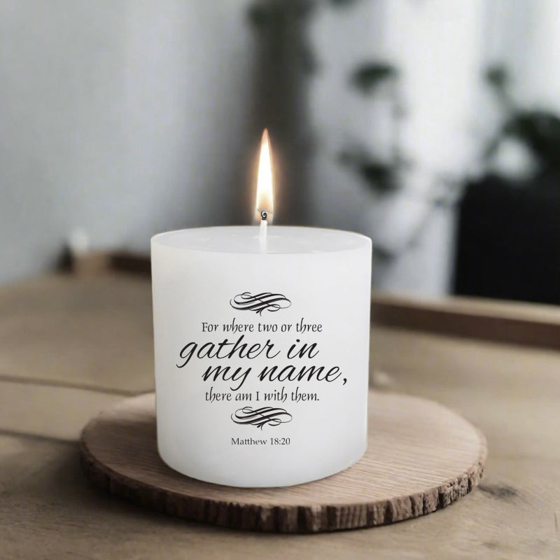 White flattop pillar candle with text on a wooden coaster