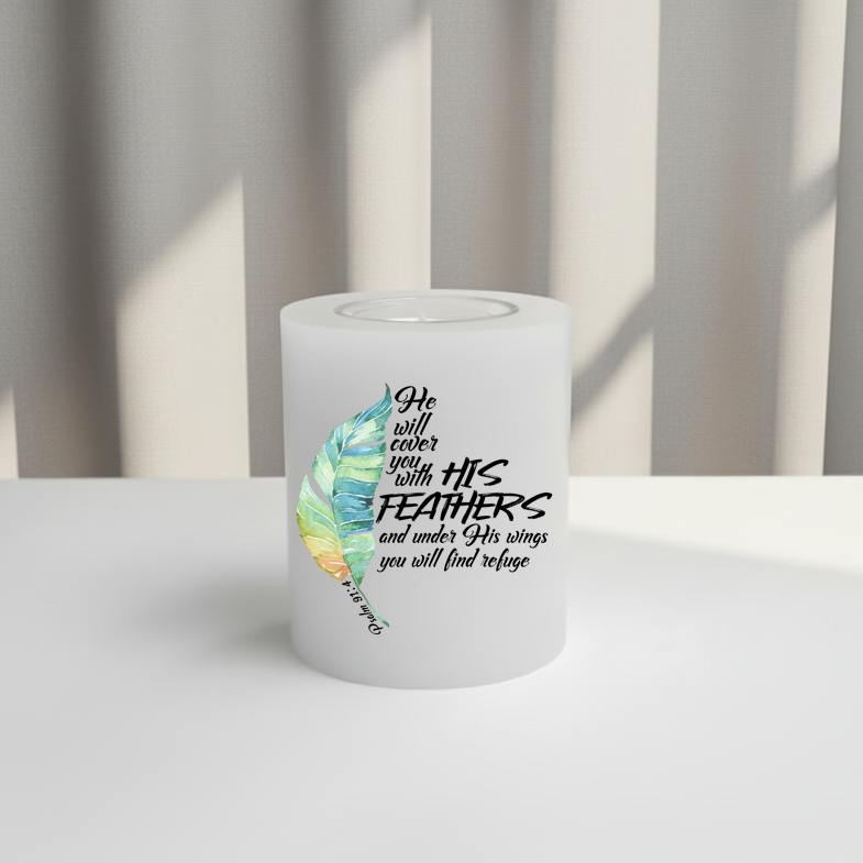 White everlasting candle with feather design and text on a white surface