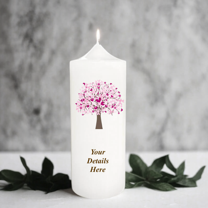 White candle with a pink tree design and 'Your Details Here' text on a gray background