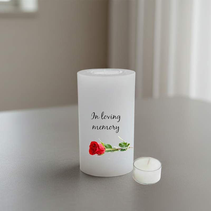 white candle printed with text and a rose 