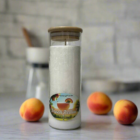 Scented Denga Candle in a glass jar with a label and bamboo lid, peach scent
