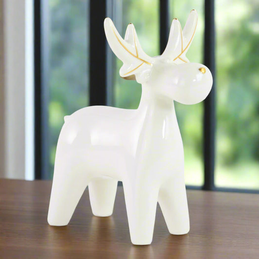 White ceramic elk or moose figurine with gold accents 