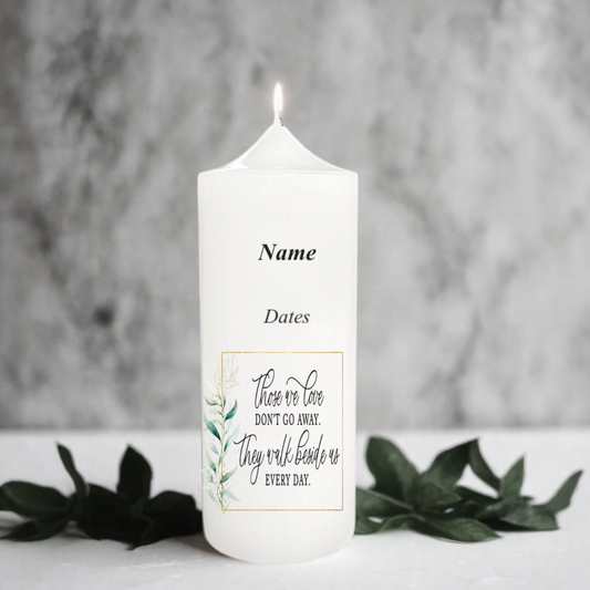 White memory candle with text and design on a gray background