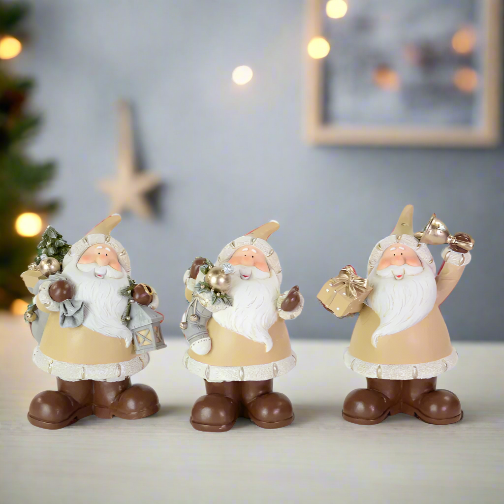 Three decorative santa figurines with Christmas accessories 