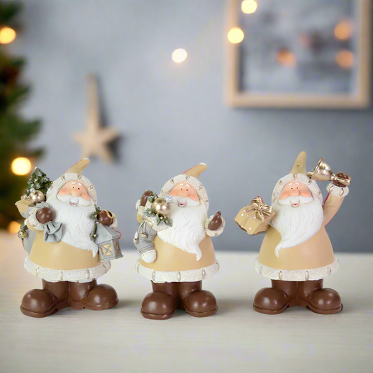 Three decorative santa figurines with Christmas accessories 