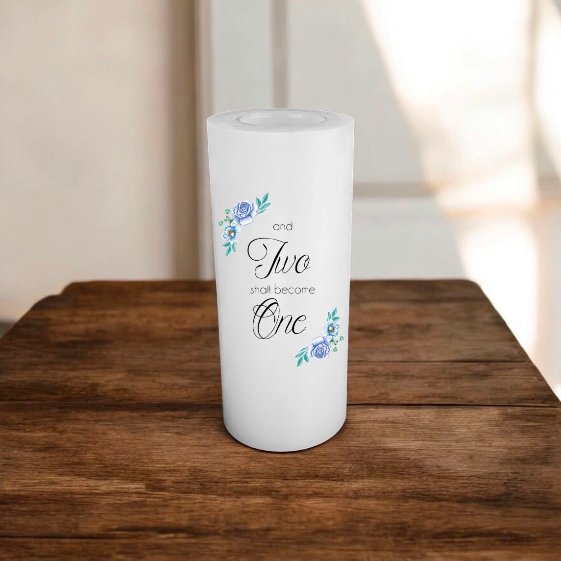 A cylindrical white candle with flowers design and a union text,