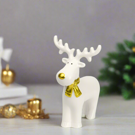 White reindeer porcelain figurine with a gold bow 