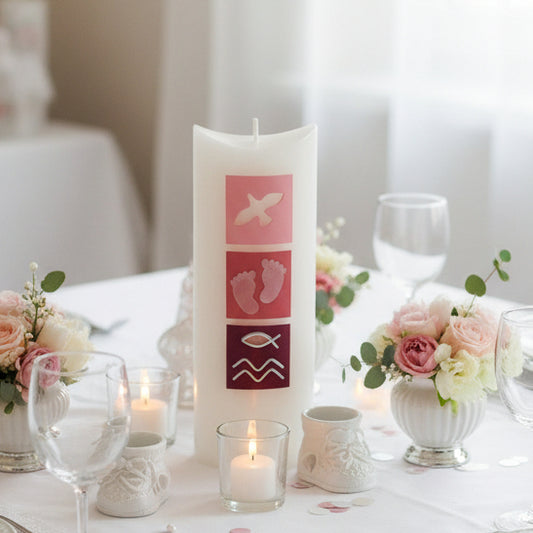christening Candle with religious symbols on a table