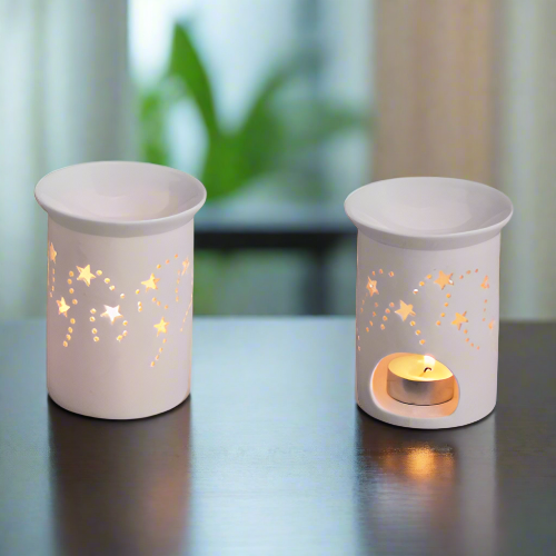 two fragrance-burner-porcelain-with star patterns on a black surface