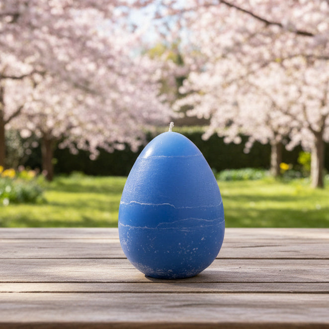 large-egg-candle-blue in a garden with cherry trees