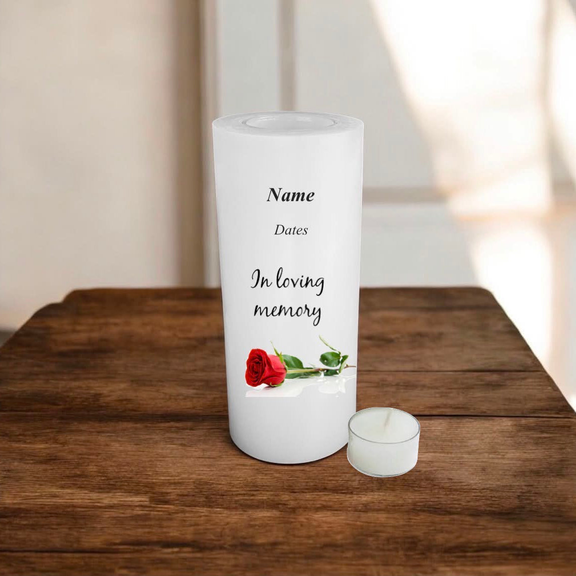 white memory candle on a wooden surface with text and a rose.