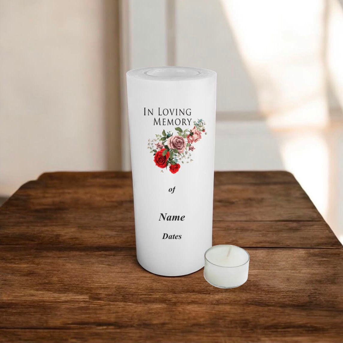 A white memorial candle standing on a wooden table, printed with the words 'IN LOVING MEMORY of Name Dates' and a small floral illustration.