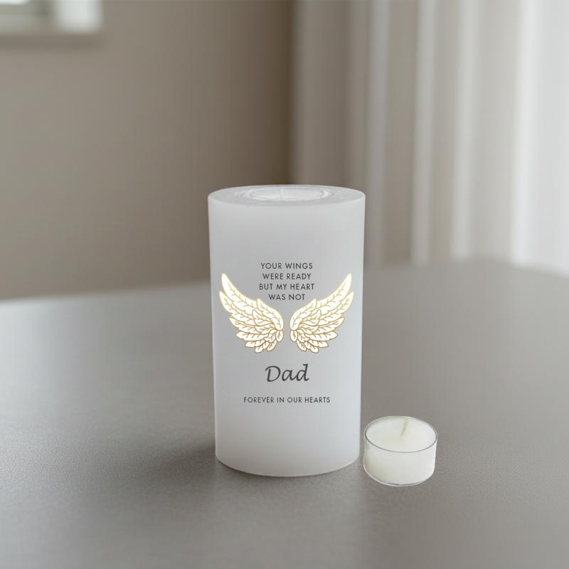 white candle with a text about Dad and wings, on a neutral background