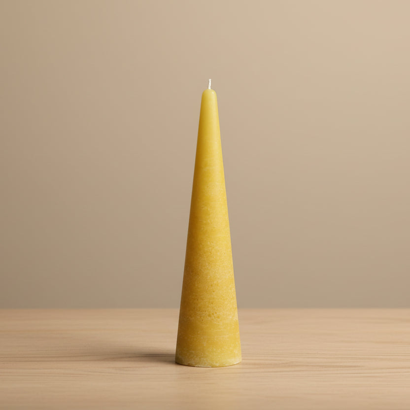 masturd cone-shaped candle on a table 